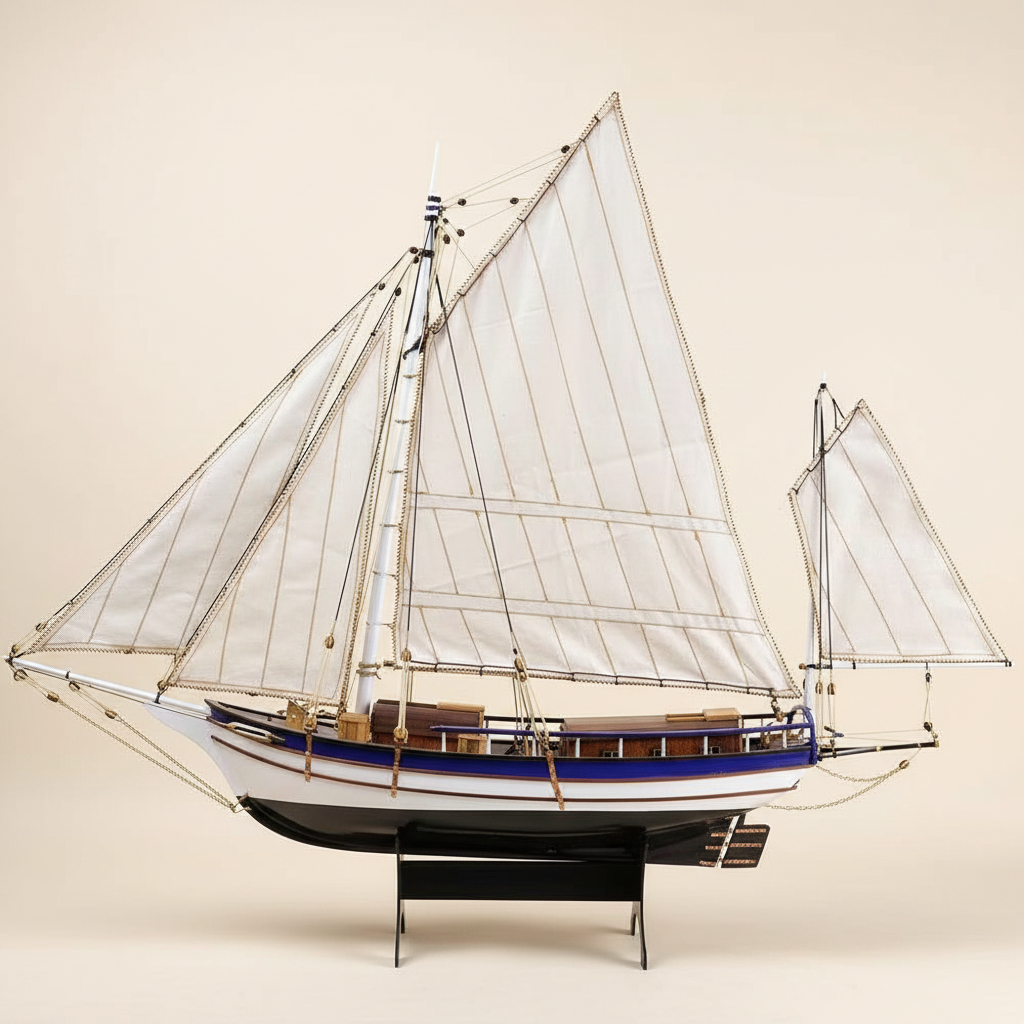 Spray Boston wooden sailboat model kit 1:30 scale side profile view showing full hull silhouette white sails and blue stripe