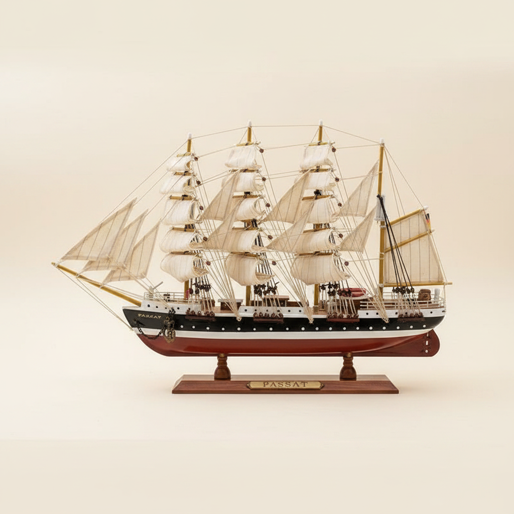 Passat four-masted barque wooden ship model perfect side profile view showing full silhouette, four masts with white square sails, black-and-white hull with red waterline, and wooden display base, 50 cm length, cream white background