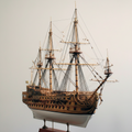 San Felipe 1:50 scale wooden ship model kit – front 3/4 angle view showing three masts, dense rope rigging, carved bow ornamentation, and two cannon decks on cream white background