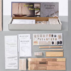 Bluenose wooden ship model kit contents showing bundled basswood and walnut planking strips rope rigging materials and labeled parts reference sheet