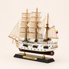 Rear 45-degree view of the A.R.C. Gloria sailing ship model showing the stern, Colombian flag, layered sails, detailed deck structures and rigging.