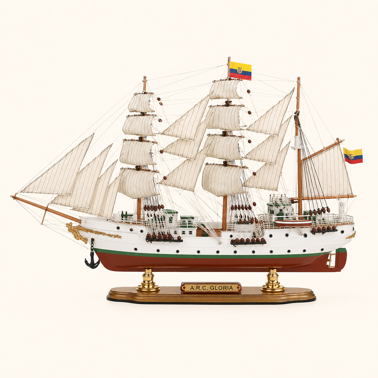 Side view of the A.R.C. Gloria three-masted tall ship model featuring cream fabric sails, intricate rope rigging, white hull with green trim, red lower hull, deck cabins and wooden presentation stand.
