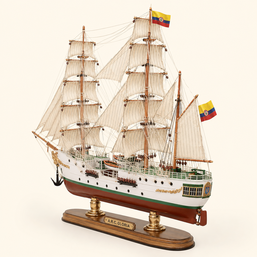 Rear 45-degree view of the A.R.C. Gloria wooden ship model showing the stern, rear deck, Colombian flags, cream sails, detailed rigging, stern decoration and polished wooden base.