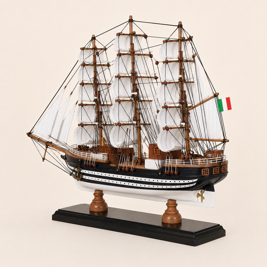 Rear 45-degree view of the Amerigo Vespucci tall ship model showing the stern, rear deck cabins, Italian flag, white sails, intricate rigging and black wooden base.