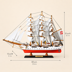 Danmark wooden tall ship model size chart showing dimensions of 65 cm long, 13 cm wide and 51 cm high, equivalent to 25.6 by 5.1 by 20.1 inches.