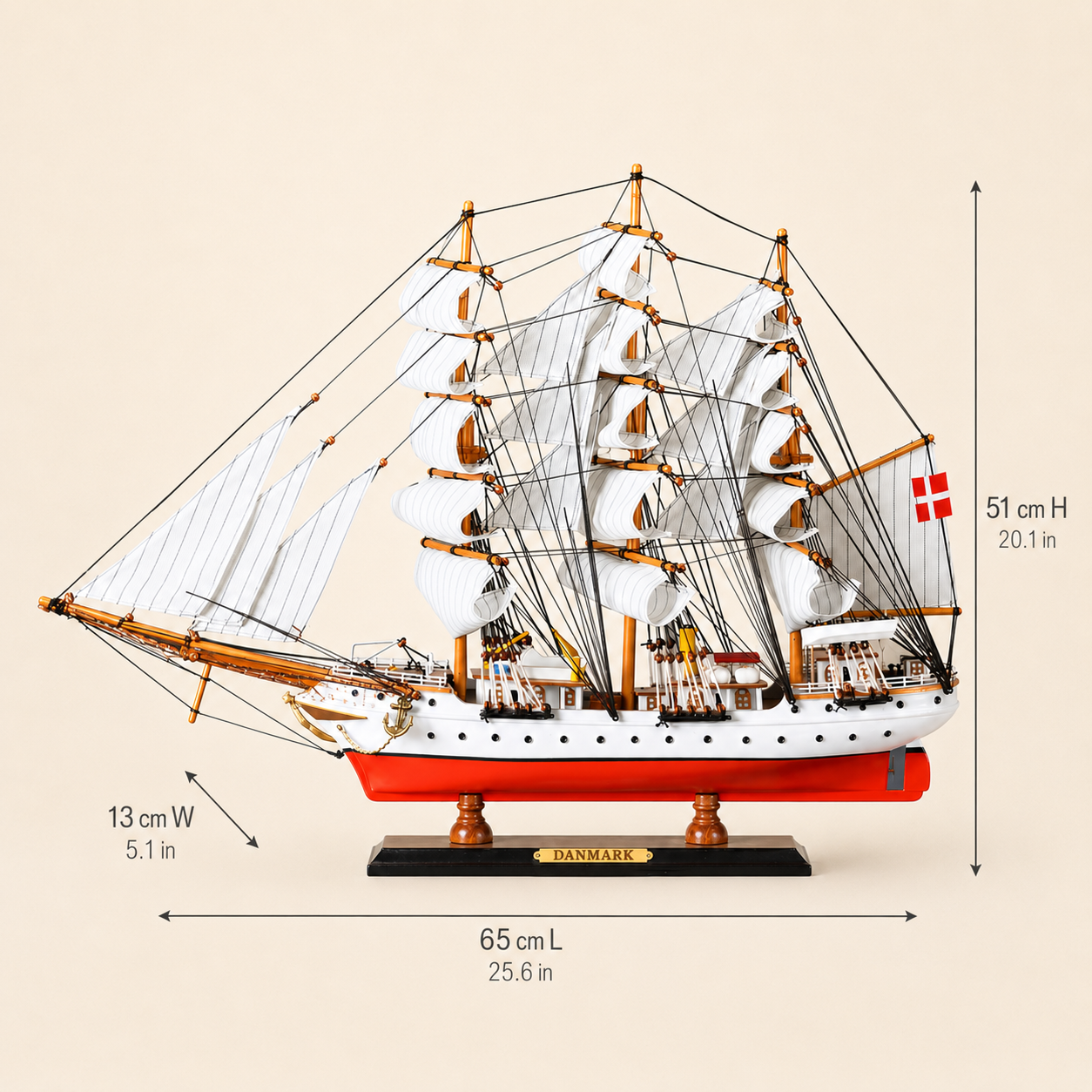Danmark wooden tall ship model size chart showing dimensions of 65 cm long, 13 cm wide and 51 cm high, equivalent to 25.6 by 5.1 by 20.1 inches.