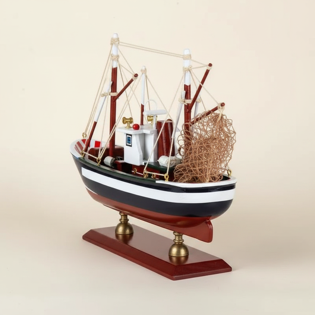 American shrimp boat wooden model rear 3/4 angle – stern detail showing rolled metal fishing net, red outrigger booms, white rope rigging, navy blue hull, and polished mahogany display base with brass ball feet, cream white background