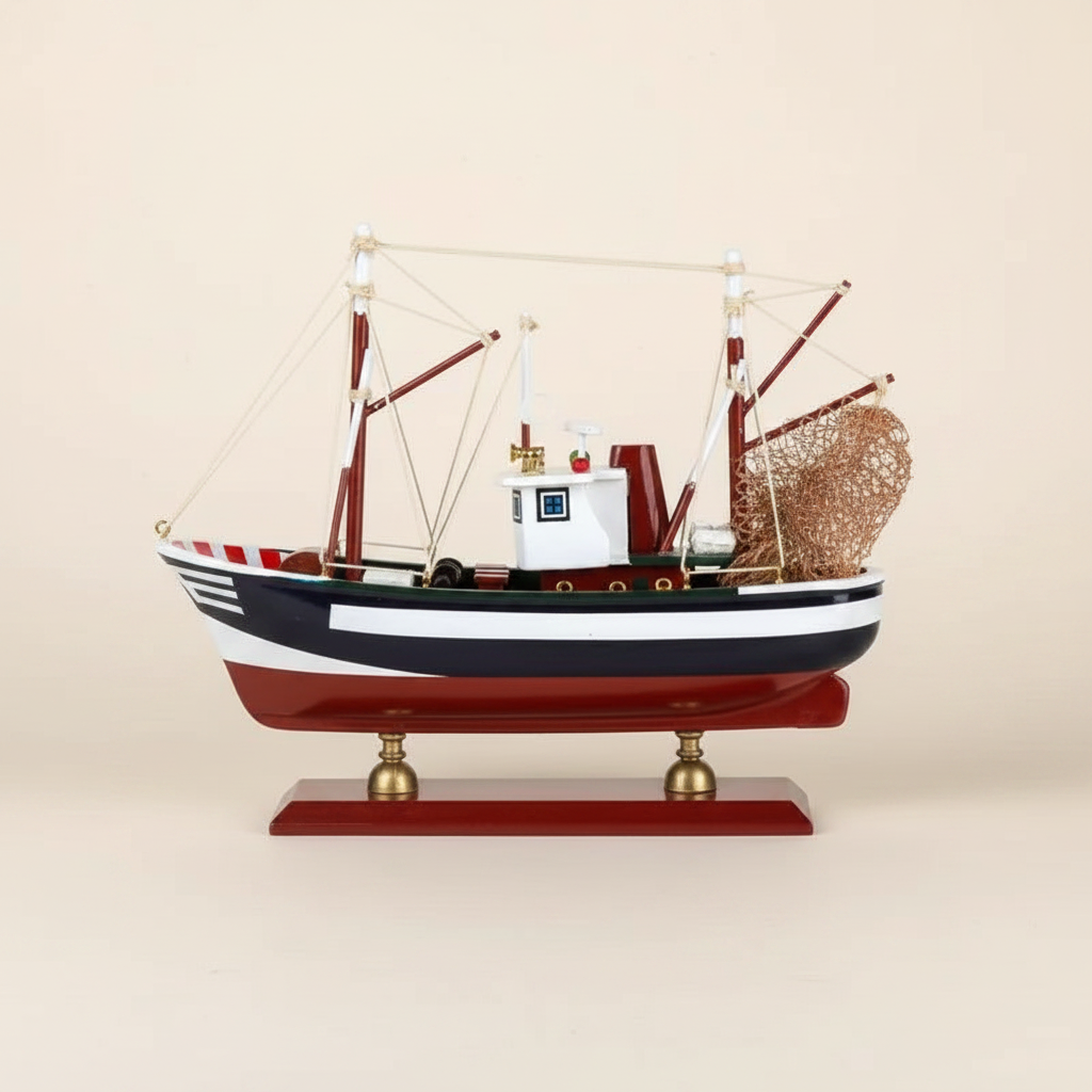 American shrimp boat wooden model rear 3/4 angle – stern detail showing rolled metal fishing net, red outrigger booms, white rope rigging, navy blue hull, and polished mahogany display base with brass ball feet, cream white background