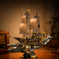 Detailed model of a pirate ship on a wooden surface with a warm background
